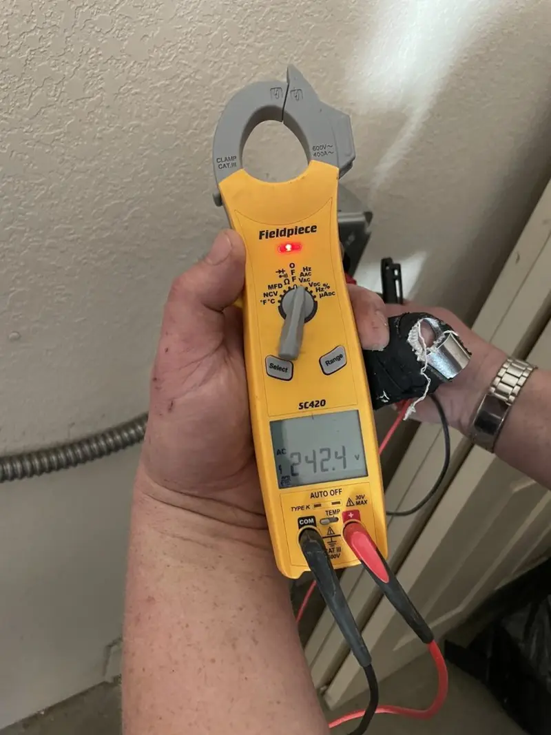 Voltage testing with clamp meter during Ceiling Fan Installation in Northborough